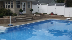 Vinyl Pool Liner, Pool Volleyball, Stone Retaining Wall, Blue Pool Water, Inground Swimming Pool