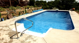 Blue Pool Water, Inground Pool with Dive, Stone Retaining Wall, Inground Pool