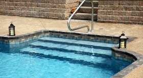 Stone Retaining Wall, Step in Pool Liner, on Step Blue Pool Water, Inground Pool